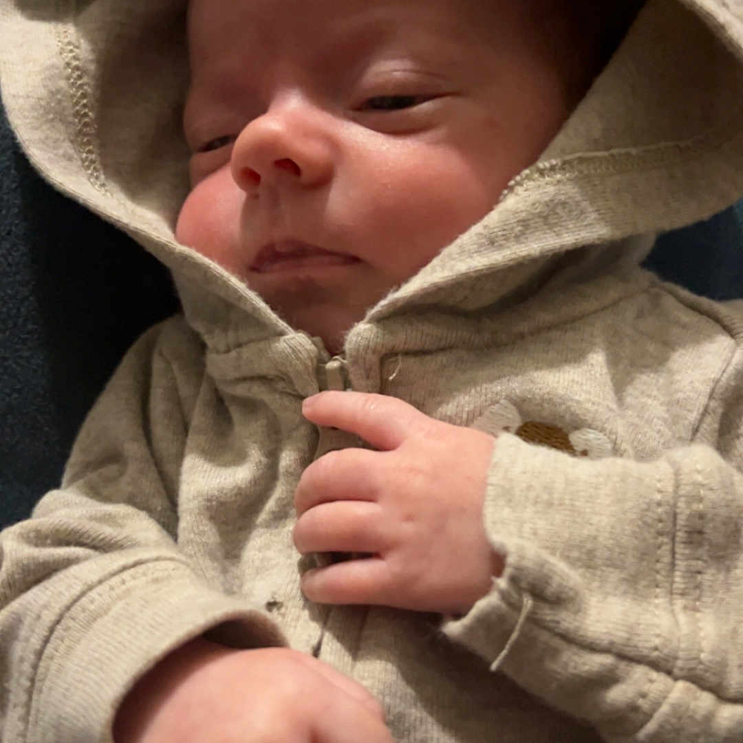 Noah is registered to the contest to win money with this photo: apparel, baby, casual, child, clothing, cozy, cute, face, hand, home, hoodie, infant, newborn, person, portrait, sleepy, soft, toddler, warm, young