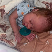 Noah joined the competition — help win amazing prizes! baby, bed, blanket, child, clothing, comfort, cozy, cute, face, head, indoor, infant, newborn, pacifier, peaceful, person, rest, sleeping, soft, toddler