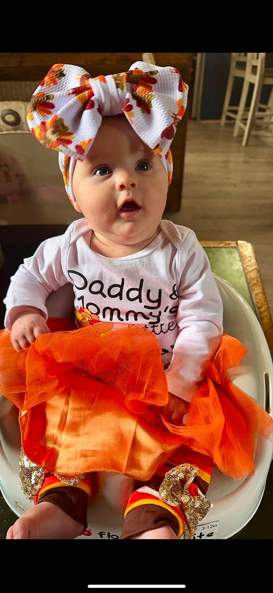 Ashlynn is registered to the contest to win money with this photo: baby, baby_toddler_clothing, cap, child, costume, costume_hat, event, face, fashion_accessory, fun, happy, hat, headwear, orange, peach, person, pink, sleeve, surprise, t_shirt