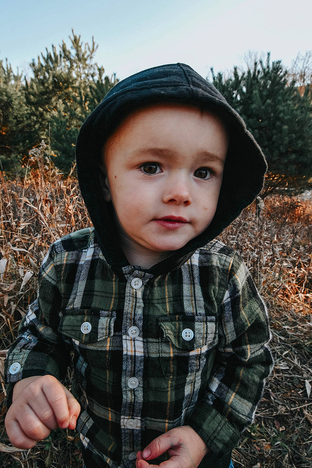 River joined the competition — help win amazing prizes! cap, child, fashion_accessory, flash_photography, fun, grass, happy, hat, headgear, pattern, people_in_nature, person, plaid, plant, sitting, sky, sleeve, tartan, toddler, tree
