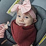 baby, infant, child, pink_bow, headband, maroon_bib, car_seat, smile, face, clothing, cute, portrait, indoors, seatbelt, apparel, person, young_child, happy, closeup, adorable