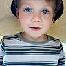 child, toddler, boy, face, blue_eyes, hat, sun_hat, striped_shirt, portrait, closeup, curious, innocent, casual, summer, outdoor, smile, eyelashes, young, person, cute