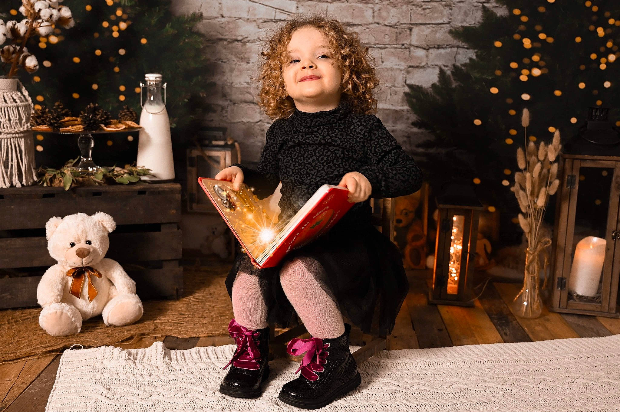 Mia participe au concours pour gagner de l'argent avec cette photo : christmas, christmas_decoration, christmas_eve, christmas_ornament, event, facial_expression, footwear, fun, happy, holiday, human_body, human_leg, lap, leg, lighting, ornament, person, sitting, thigh, toddler