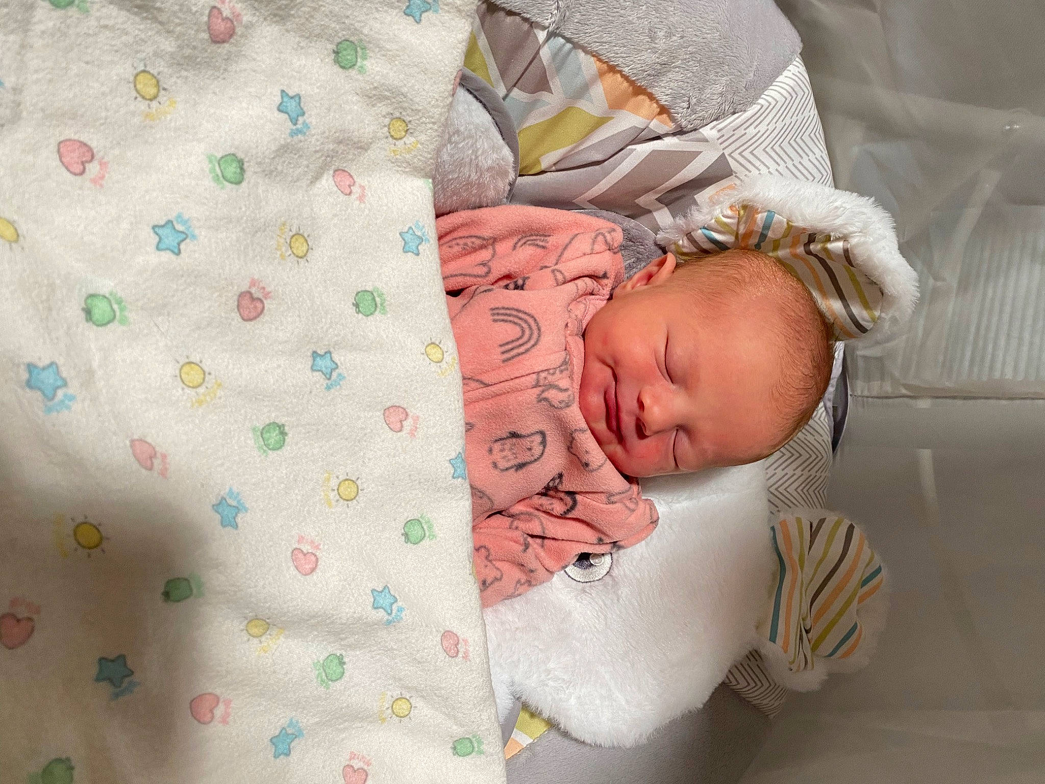 Sieanna is registered to the contest to win money with this photo: arm, baby, baby_products, baby_sleeping, baby_toddler_clothing, bedding, cheek, child, comfort, couch, face, head, human_body, linens, pattern, person, product, skin, sleeve, textile