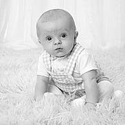 James joined the competition — help win amazing prizes! baby, child, infant, portrait, black_and_white, curtains, fluffy_rug, sitting, cute, wide_eyes, overall, knitted_tights, soft_lighting, indoor, young_child, monochrome, studio_photo, curiosity, expression, pose