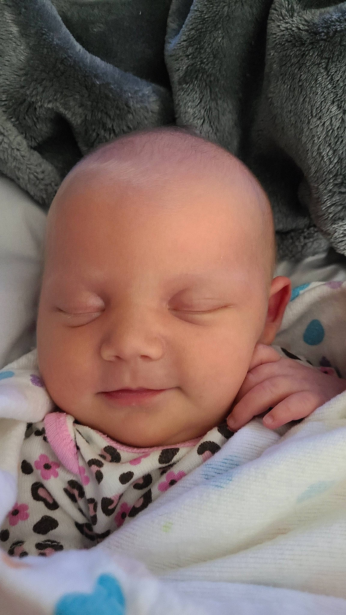 Harper is registered to the contest to win money with this photo: baby, baby_sleeping, baby_toddler_clothing, cheek, chin, comfort, eyebrow, eyelash, facial_expression, gesture, happy, head, iris, linens, lip, mouth, nose, person, pink, skin