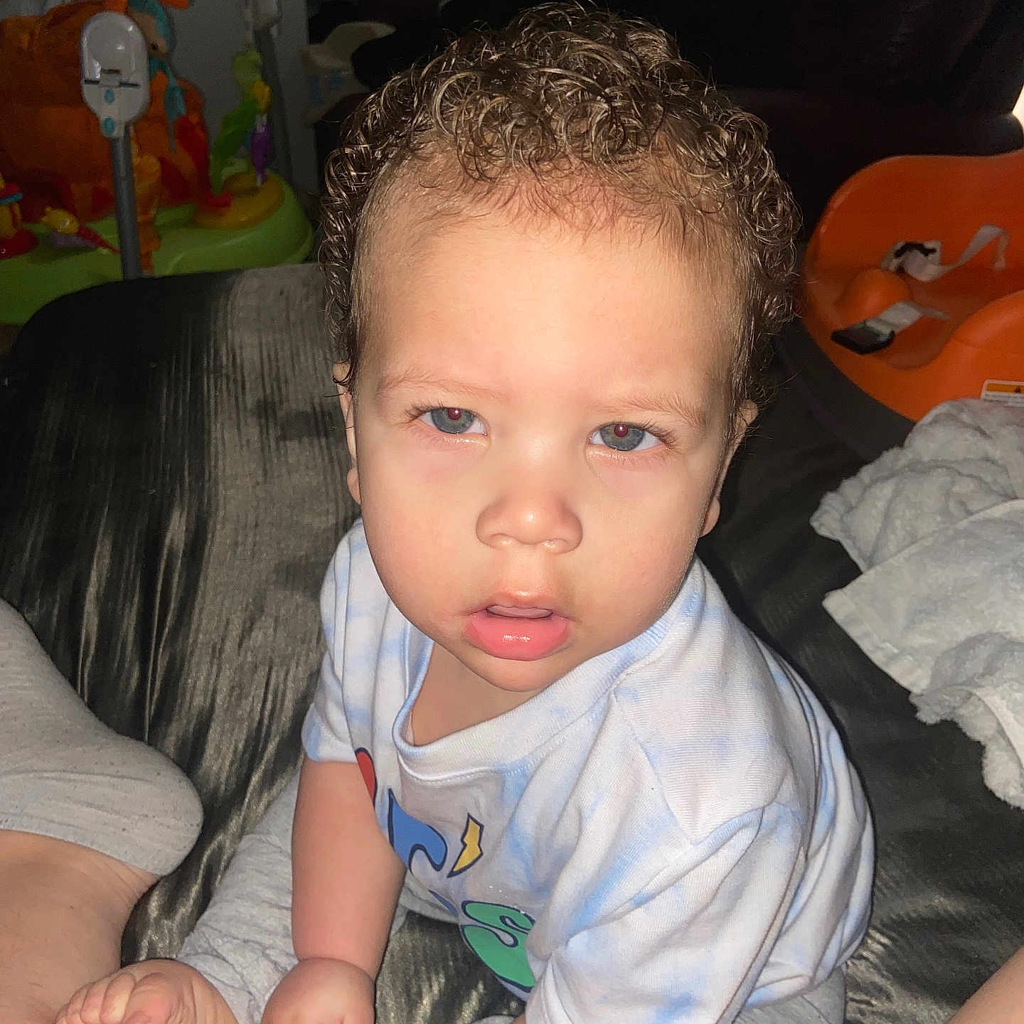 Kyson is registered to the contest to win money with this photo: baby, bed, bedroom, bodypart, clothing, couch, cushion, face, finger, furniture, hair, head, homedecor, indoors, person, photography, portrait, room, sitting, t_shirt
