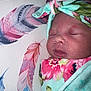 My Ari is registered to the contest to win money with this photo: baby, blanket, child, closeup, cute, face, feathers, floral_pattern, head_wrap, indoors, infant, newborn, peaceful, portrait, resting, skin, sleeping, soft_texture, swaddled, tender