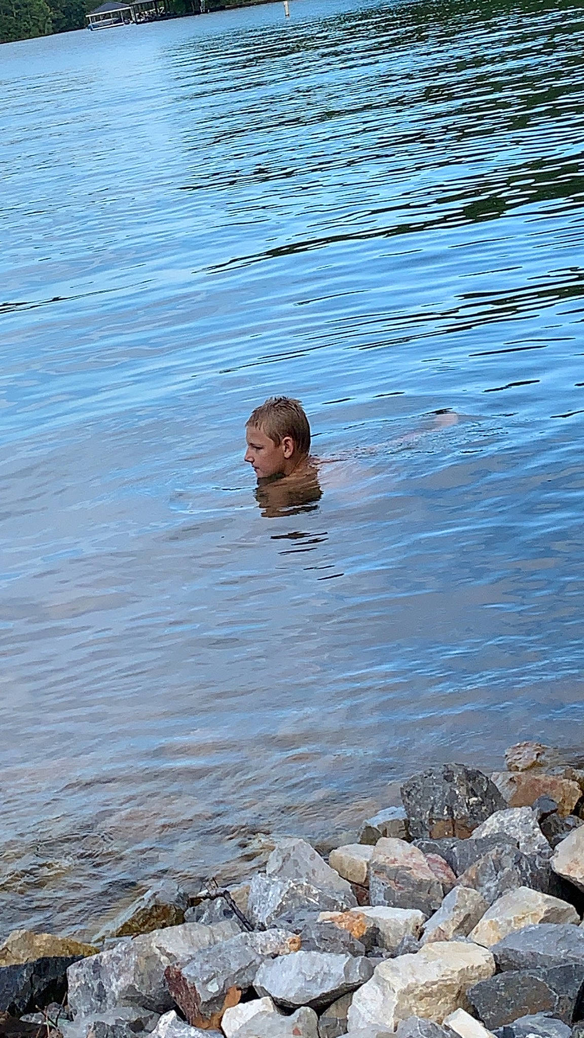 Rodney Harris is registered to the contest to win money with this photo: barechested, bathing, fun, happy, lake, leisure, liquid, ocean, person, recreation, reflection, reservoir, river, rock, sea, vacation, water, water_resources, watercourse, wave