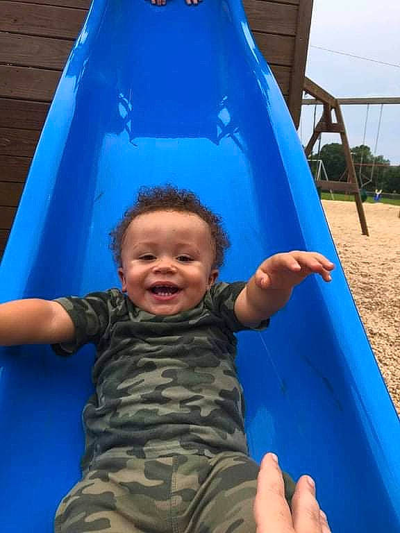Stephan joined the competition — help win amazing prizes! azure, black, blue, chute, facial_expression, fun, green, happy, leisure, light, outdoor_play_equipment, person, photograph, playground, public_space, shade, sky, smile, toddler, white