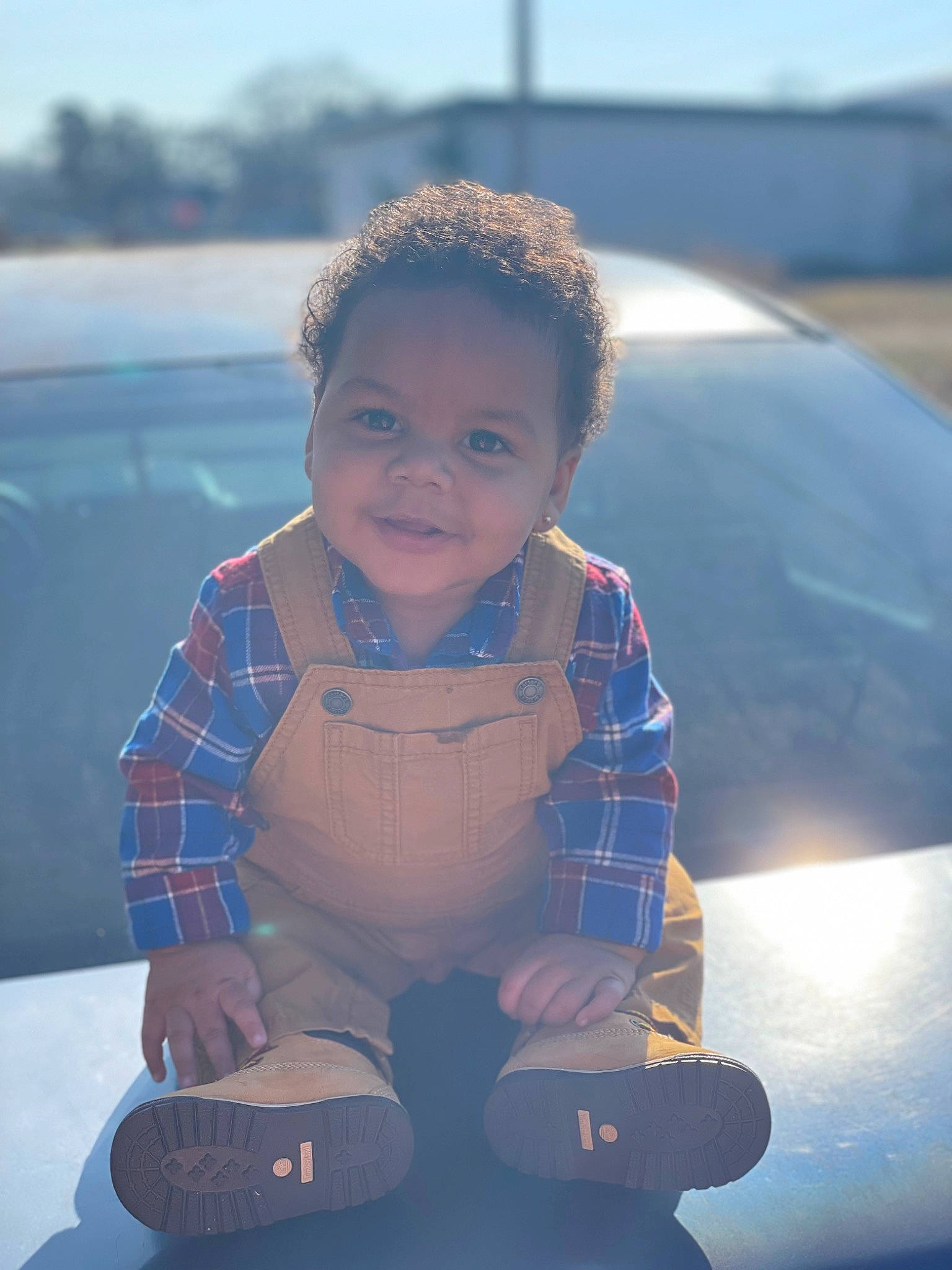 Jakobi is registered to the contest to win money with this photo: automotive_design, automotive_exterior, azure, bumper, car, electric_blue, flash_photography, fun, grass, happy, hood, joy, leisure, person, personal_protective_equipment, recreation, sky, tints_and_shades, toddler, travel