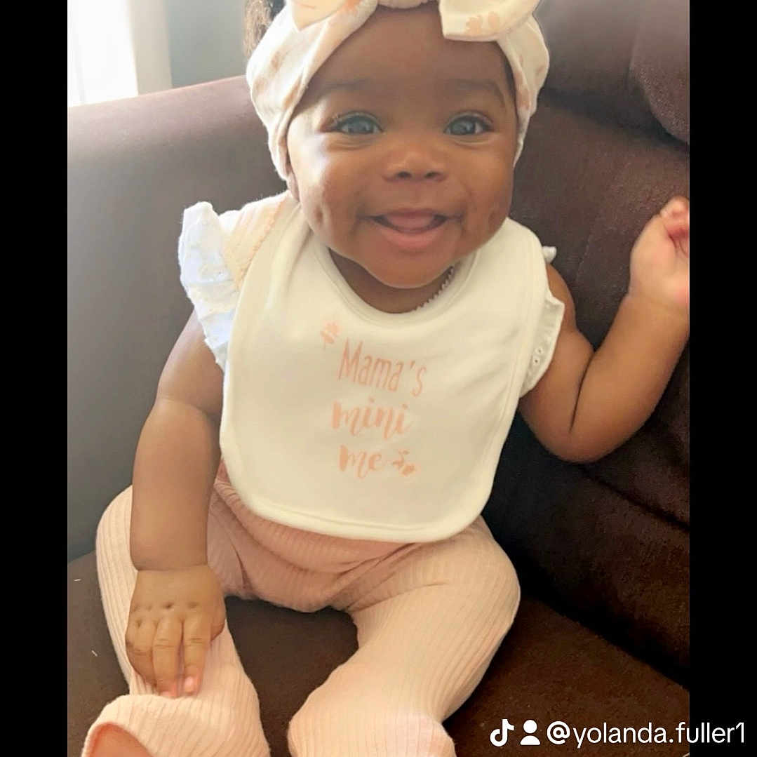 Ja Kilah is registered to the contest to win money with this photo: baby, bonnet, cap, clothing, couch, cushion, face, furniture, happy, hat, head, homedecor, laughing, newborn, person, photography, portrait, sitting, smile, t_shirt
