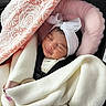Delilah joined the competition — help win amazing prizes! baby, sleeping, blanket, headband, car_seat, pink, white, lace, bow, infant, child, cozy, cute, peaceful, wrapped, seatbelt, newborn, soft, portrait, resting