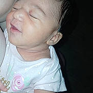 Ava is registered to the contest to win money with this photo: baby, infant, sleeping, person, arm, clothing, onesie, polka_dot, pink, rose, skin, head, face, hand, newborn, cute, closeup, child, holding, resting