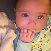 Naïm participe au concours pour gagner de l'argent avec cette photo : baby, infant, child, face, hand, fingers, blanket, clothing, blue_outfit, pixar, indoor, portrait, cute, young_child, sleepwear, soft_lighting, closeup, lying_down, expression, cozy