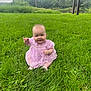 Hazel is registered to the contest to win money with this photo: baby, child, grass, outdoor, greenery, dress, pink, smiling, sitting, nature, trees, sky, cloudy, river, happy, person, young_child, cute, summer, footwear