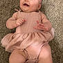 baby, infant, smiling, pink_dress, headband, carpet, happy, child, cute, footwear, shoe, white, pink, lying_down, playful, chubby_legs, toddler, indoors, person, apparel