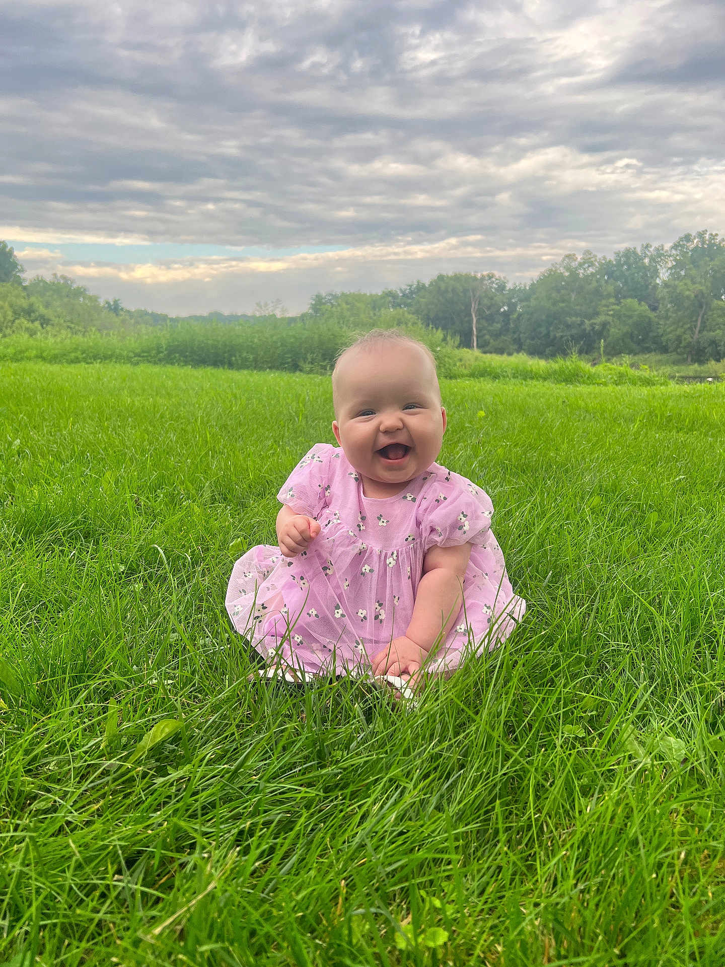 Hazel joined the competition — help win amazing prizes! baby, child, grass, greenery, outdoor, field, nature, smiling, happy, pink_dress, cloudy_sky, grass_blades, cute, sitting, infant, portrait, daylight, young_child, cheerful, flora