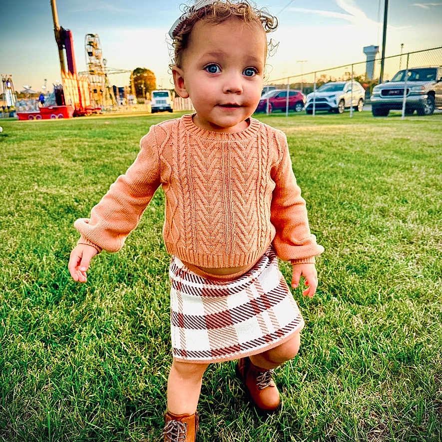 Kenleigh joined the competition — help win amazing prizes! baby, bodypart, car, clothing, dress, face, finger, grass, head, knitwear, lawn, person, photography, plant, portrait, shorts, skirt, sweater, transportation, vehicle