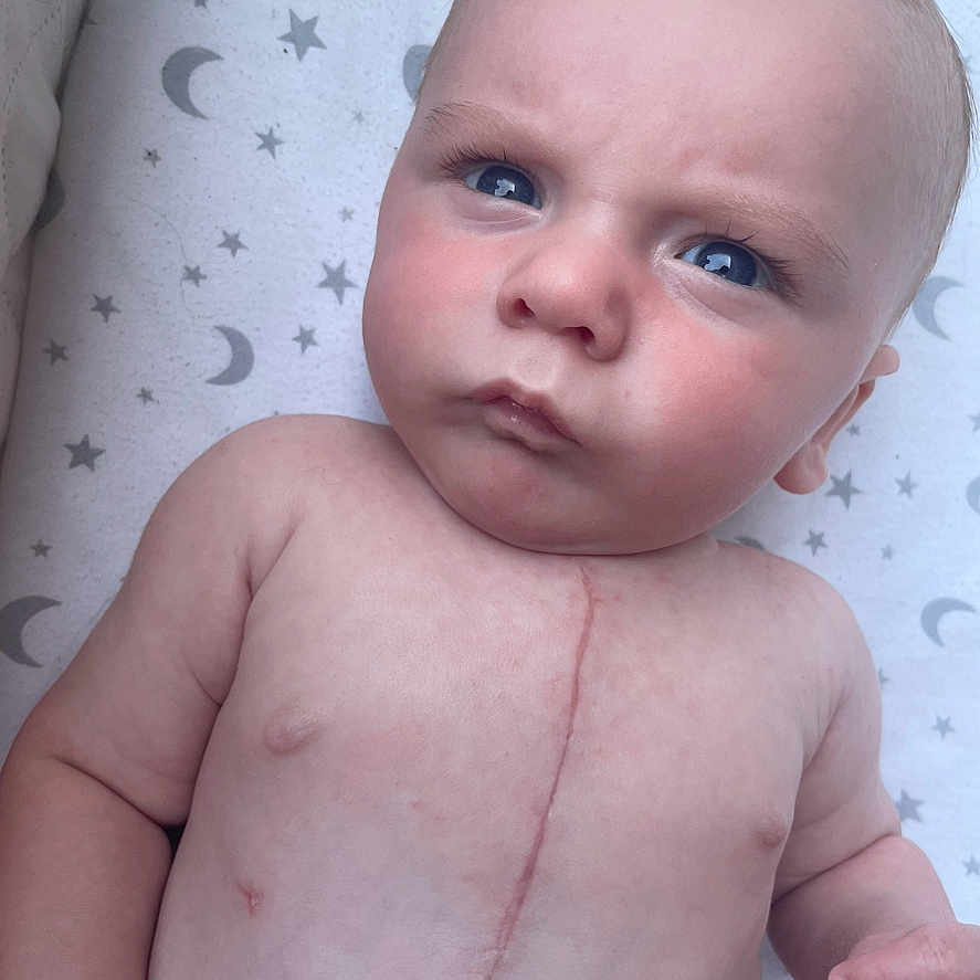 William is registered to the contest to win money with this photo: baby, bodypart, face, finger, fist, frown, hand, happy, head, mouth, neck, newborn, person, photography, portrait, sad, smile, wrist