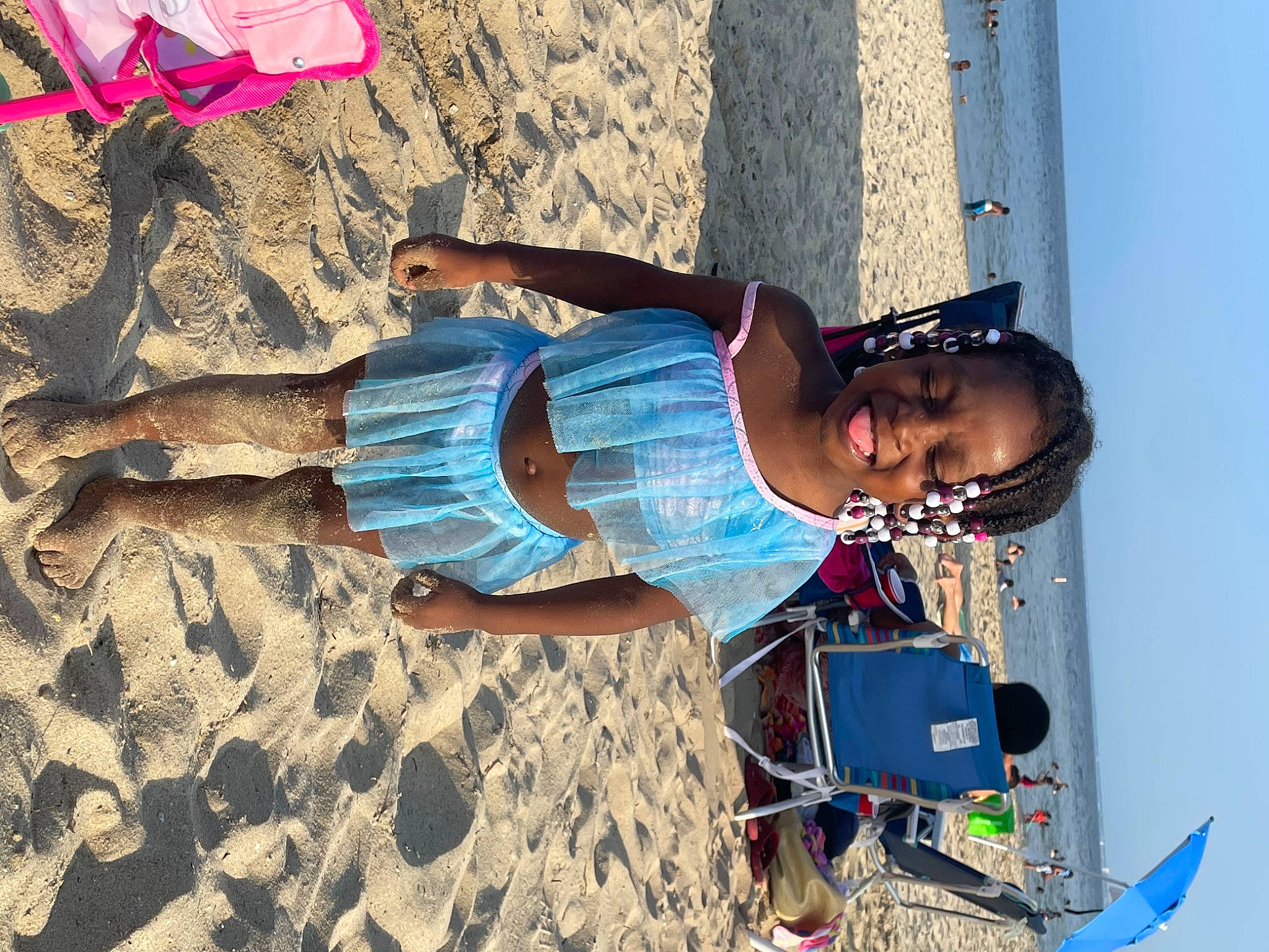 Asa is registered to the contest to win money with this photo: azure, beach, blue, electric_blue, eyewear, fun, human_leg, joy, landscape, leisure, person, photograph, sand, shadow, sky, smile, summer, sun_tanning, sunglasses, travel