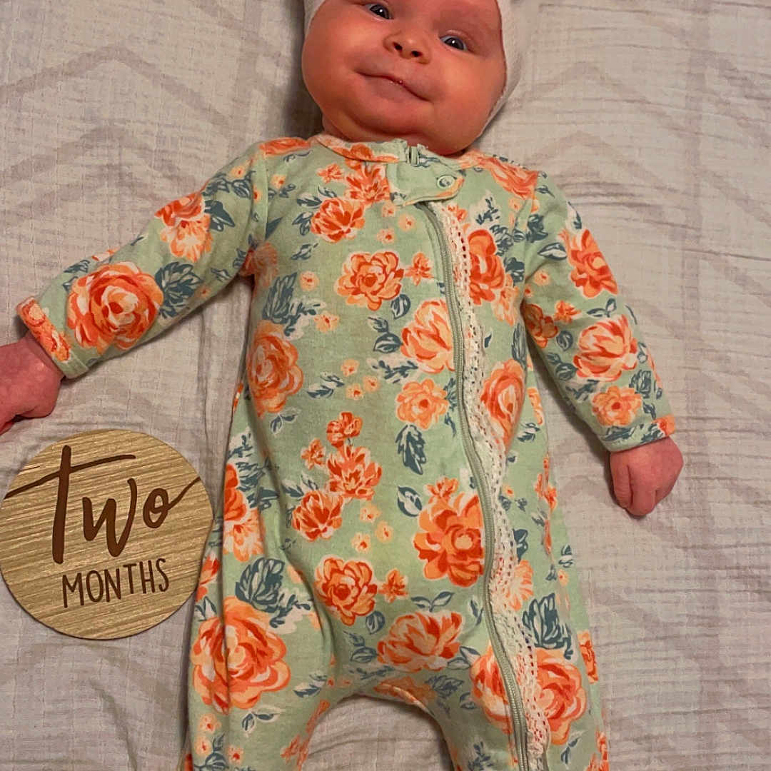 Kalli joined the competition — help win amazing prizes! baby, bed, bonnet, cap, clothing, dress, face, flower, furniture, hat, head, newborn, pants, person, photography, plant, portrait, quilt, rose, toy