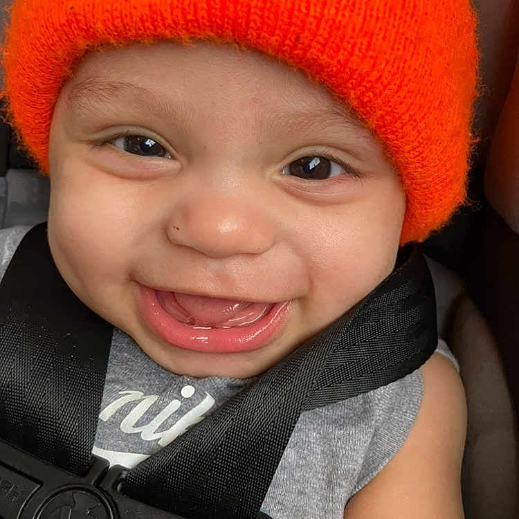 Deshawn joined the competition — help win amazing prizes! baby, baseballcap, beanie, bodypart, cap, clothing, coat, cosmetics, face, happy, hat, head, laughing, lipstick, mouth, person, photography, portrait, smile, teeth