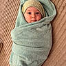 Kasin joined the competition — help win amazing prizes! baby, infant, child, wrapped, blanket, swaddled, hat, cap, polka_dot, mint_green, couch, sofa, textile, cozy, portrait, face, eyes, indoors, sleeping_area, photography