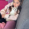 Mia participe au concours pour gagner de l'argent avec cette photo : child, girl, cat, pet, sofa, couch, pillow, pink, purple, casual_clothing, indoor, relaxed, domestic_animal, portrait, young, cozy, cute, animal, home, companionship