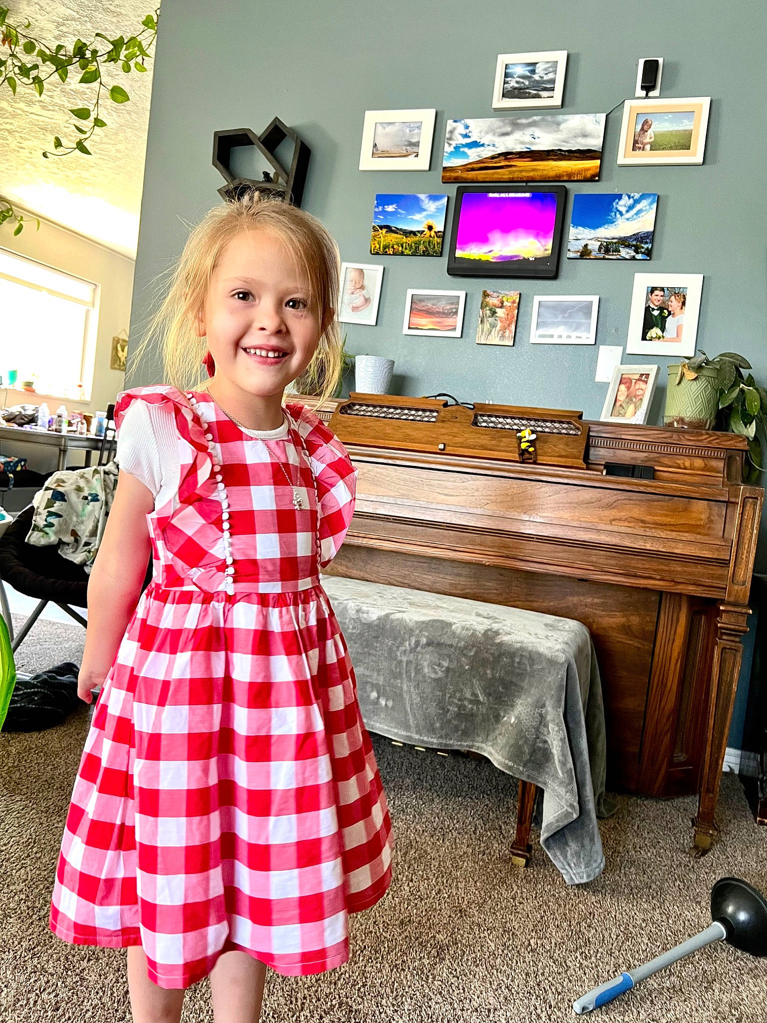 Jenny is registered to the contest to win money with this photo: child, day_dress, desk, dress, fashion_design, flooring, fun, hairstyle, happy, house, joy, magenta, pattern, person, plaid, room, sleeve, smile, table, tartan