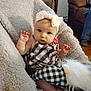 Abby is registered to the contest to win money with this photo: baby, blanket, bow, checkered_pattern, child, clothing, couch, cozy, cute, floor, furniture, headband, home, indoor, infant, person, plush_toy, portrait, sitting, soft_toy