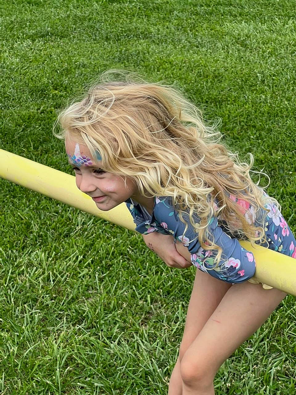 Quinn is registered to the contest to win money with this photo: blond, brown_hair, denim, electric_blue, eyewear, fun, grass, grass_family, grassland, happy, human_leg, knee, lawn, leisure, long_hair, pattern, people_in_nature, person, sunglasses, surfer_hair