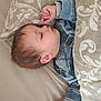 baby, bed, blanket, child, clothing, cozy, cute, denim, face, hand, indoor, infant, peaceful, pillow, portrait, relaxing, resting, sleeping, soft, young