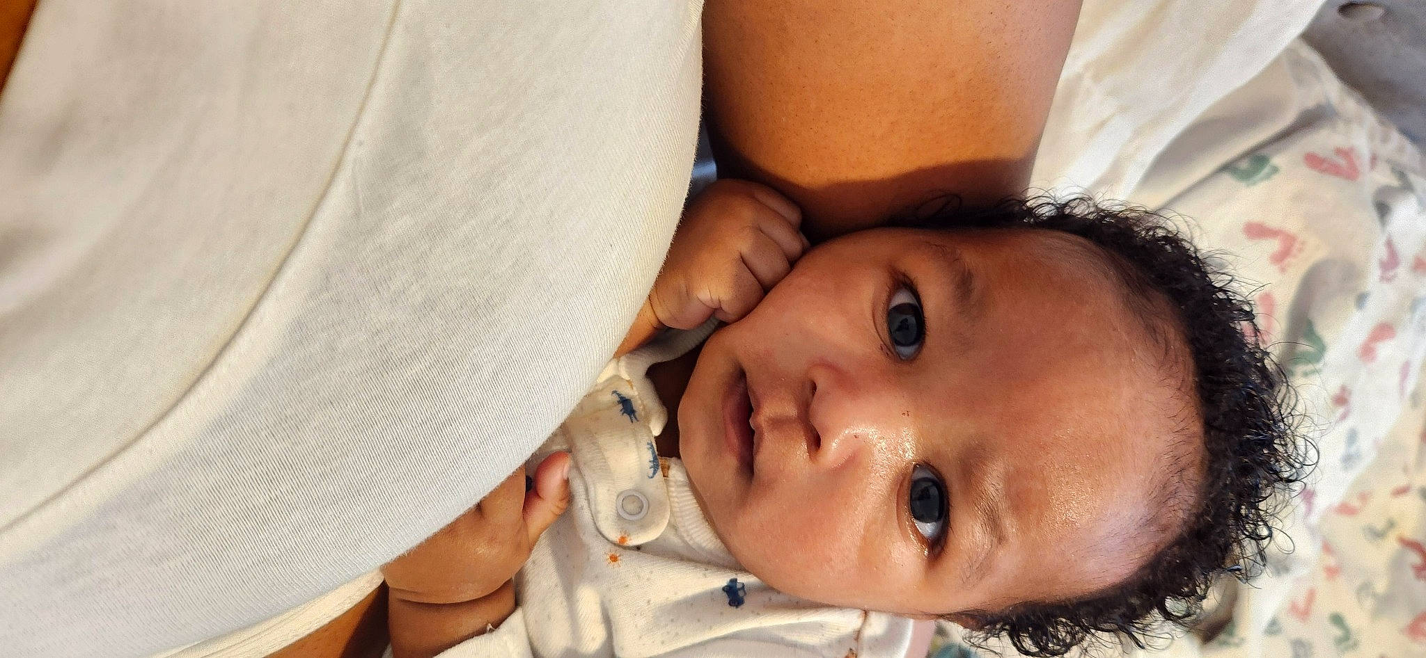 Kyro is registered to the contest to win money with this photo: baby, cheek, chest, close_up, comfort, eyelash, fashion_accessory, gesture, happy, hat, headgear, lip, neck, nose, person, plant, skin, smile, sun_hat, toddler