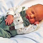 Hudson joined the competition — help win amazing prizes! newborn, baby, sleeping, infant, portrait, close_up, face, hands, formalwear, bow_tie, suspenders, white_shirt, green_clothing, bed, bedding, indoors, peaceful, resting, cute, photography