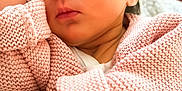 Lylie participe au concours pour gagner de l'argent avec cette photo : newborn, baby, sleeping, pink_sweater, knitted, hand, face, closed_eyes, blanket, soft_texture, cozy, infant, child, portrait, peaceful, cute, resting, warm_colors, indoors, closeup