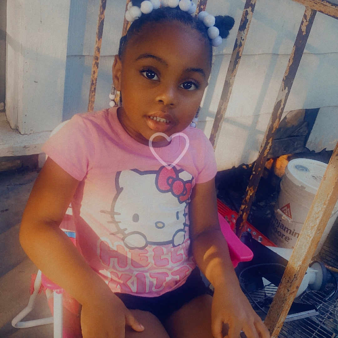 Ariyah joined the competition — help win amazing prizes! accessories, chair, child, clothing, crib, face, female, footwear, furniture, girl, hat, head, infantbed, person, photography, portrait, shoe, shorts, sitting, t_shirt