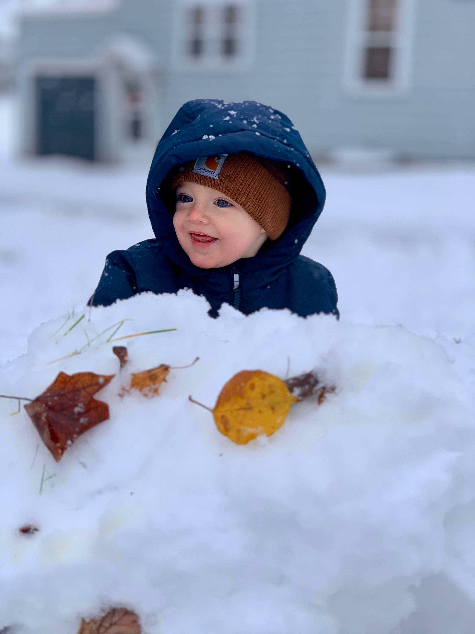 Andrei is registered to the contest to win money with this photo: bonnet, child, freezing, joy, person, play, playing_in_the_snow, smile, snow, snowman, toddler, winter