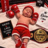baby, newborn, sleeping, portrait, boxing, boxing_gloves, championship_belt, knitted_clothing, red, white, crown, royal_theme, blanket, indoor, face, infant, costume, sports_theme, text_sign, photography