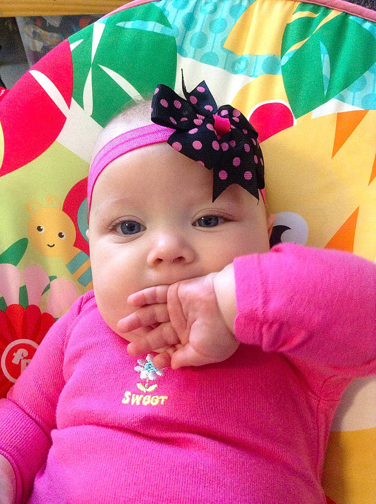 Alaysia is registered to the contest to win money with this photo: baby, baby_products, cheek, child, face, hair_accessory, head, headband, headgear, headwear, lip, magenta, person, pink, skin, smile, toddler