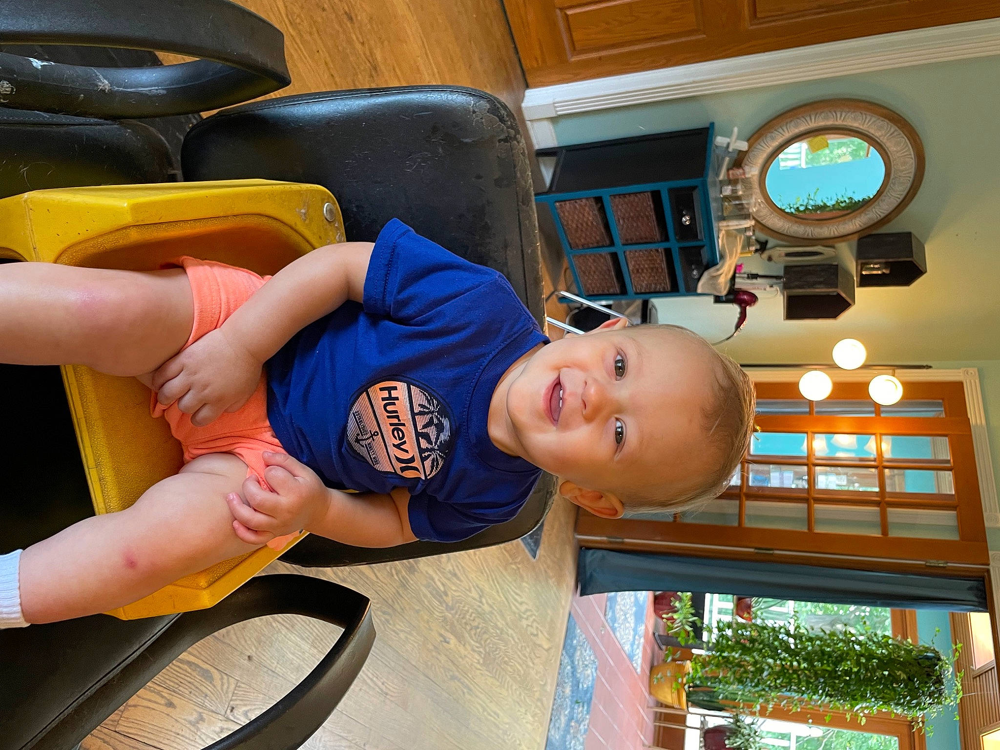Hunter joined the competition — help win amazing prizes! baby, baby_toddler_clothing, chair, child, comfort, flooring, fun, hat, human_leg, joy, knee, leisure, person, play, room, sitting, smile, sportswear, t_shirt, thigh