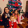 Kaïs a rejoint le concours — aidez-le/la à gagner de superbes lots ! child, children, christmas_tree, holiday, pajamas, smiling, indoors, floor, decorations, lights, red_clothing, glasses, long_hair, barefoot, tiled_floor, family, festive, happy, cute, toddler
