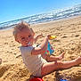 Kaïs a rejoint le concours — aidez-le/la à gagner de superbes lots ! toddler, child, beach, sand, bucket, shovel, pacifier, ocean, sea, sky, sunny, play, toy, summer, barefoot, water, waves, outdoor, holiday, fun