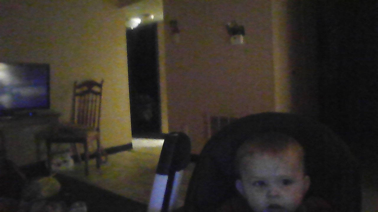 Karson is registered to the contest to win money with this photo: ceiling, chair, darkness, door, event, flooring, fun, hardwood, house, person, room, sitting, table, toddler, wood