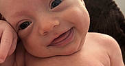 Grayson joined the competition — help win amazing prizes! newborn, baby, infant, child, smiling, happy, face, portrait, close_up, eyes, blond_hair, bare_shoulders, sitting, cuddling, indoors, warm_lighting, knitted_blanket, soft_focus, family, adorable