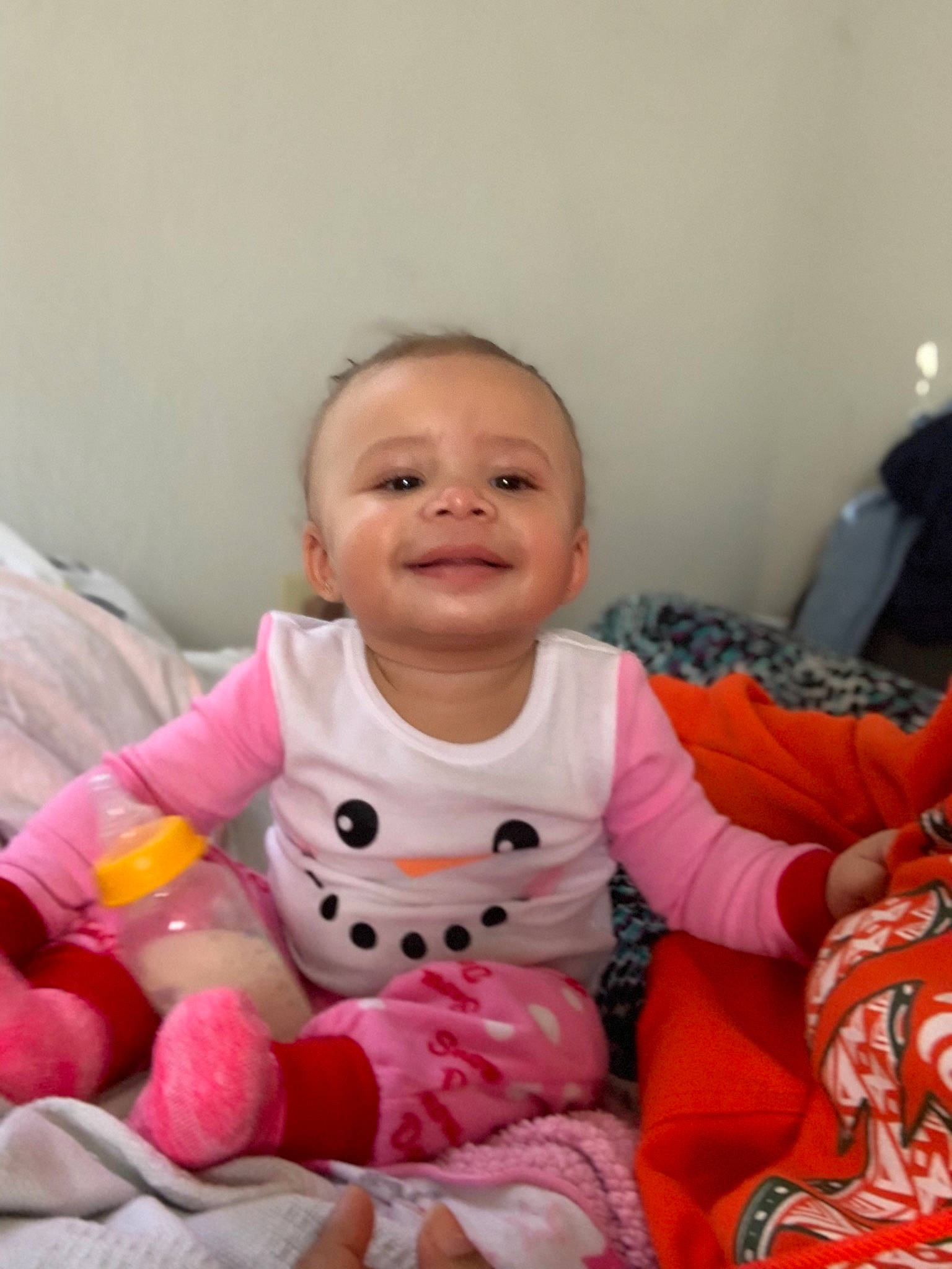 Danarah is registered to the contest to win money with this photo: baby, cheek, child, face, happy, person, pink, room, skin, smile, stuffed_toy, toddler