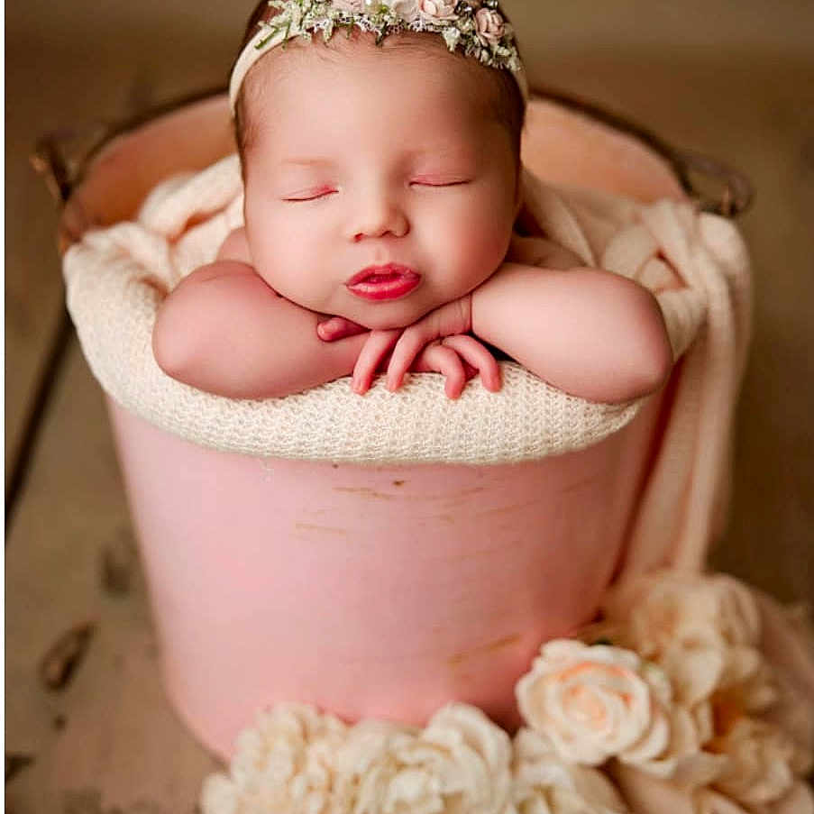 Kinsley Rae is registered to the contest to win money with this photo: accessories, baby, basket, bathing, blanket, diamond, face, flower, gemstone, head, jewelry, newborn, people, person, petal, photography, plant, portrait, rose, sleeping