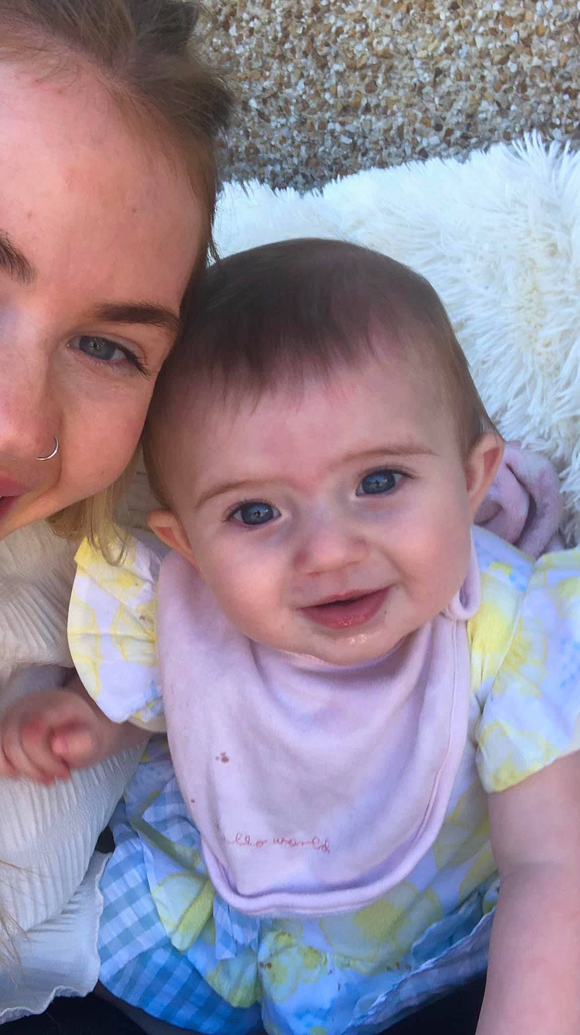 Blaise is registered to the contest to win money with this photo: baby_toddler_clothing, cheek, chin, eye, eyebrow, forehead, gesture, grass, hair, happy, head, human_body, iris, lip, mouth, nose, person, plant, skin, smile