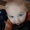 Alistair joined the competition — help win amazing prizes! baby, child, blue_eyes, close_up, face, curious, infant, looking, selfie, expression, skin, head, hair, mouth, tongue, patterned_clothing, floor, indoors, person, young