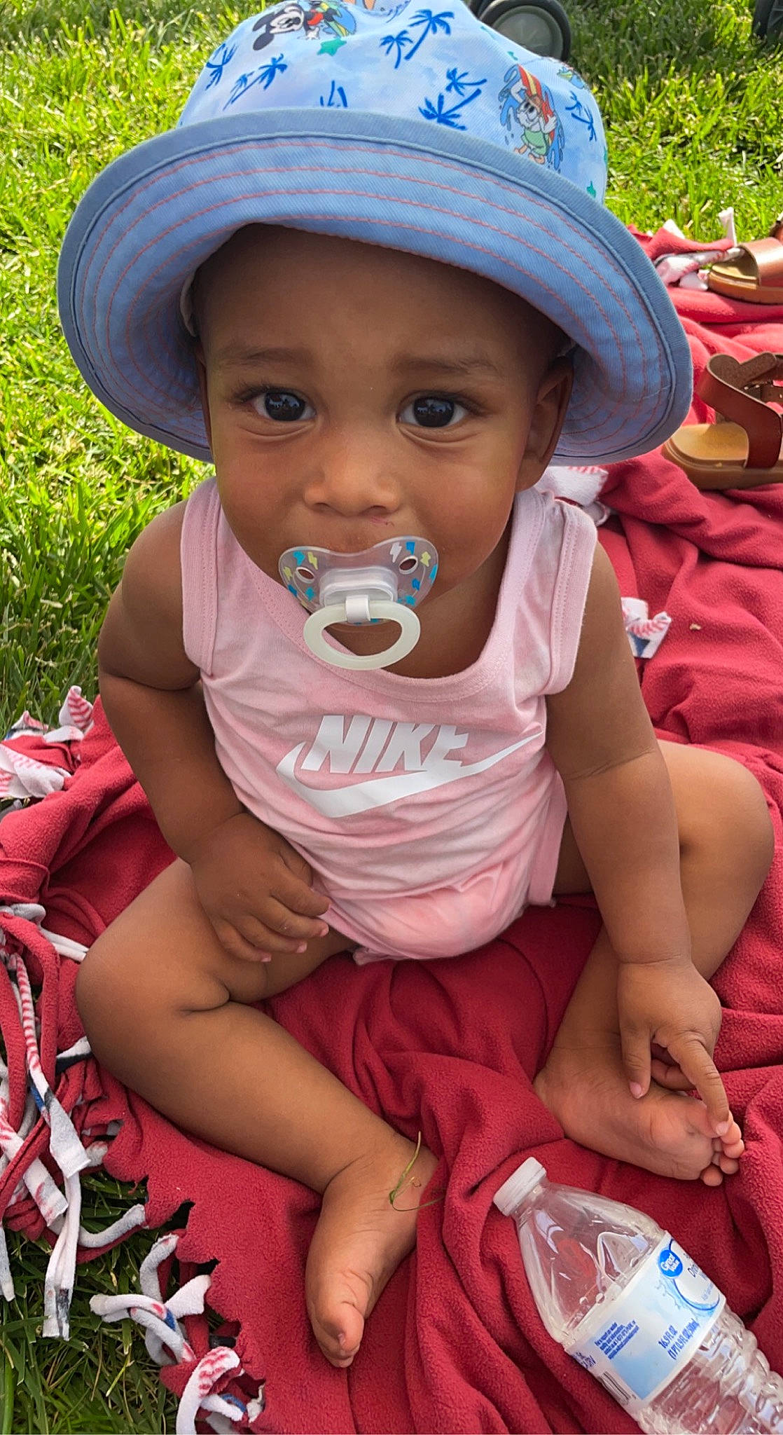 Jordyn joined the competition — help win amazing prizes! baby, baby_toddler_clothing, cap, child, face, facial_expression, fun, grass, green, happy, hat, headwear, leaf, lip, mouth, person, pink, plant, skin, summer